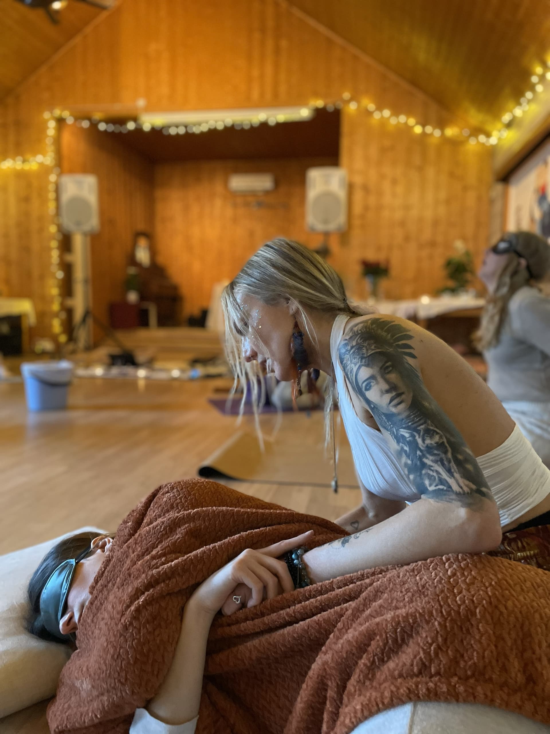 Lina providing healing bodywork session in sacred space